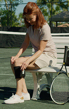 Woman playing tennis and using BeActive Plus